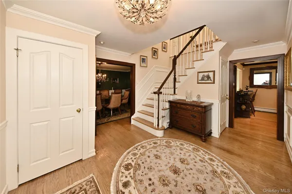 a view of a livingroom with furniture and staircase