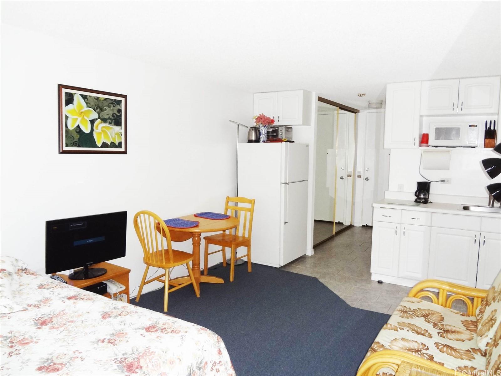 2572 Lemon Road, Unit 502 Honolulu, HI 96815 - Photo 1 of 7 a bedroom with furniture and a bed