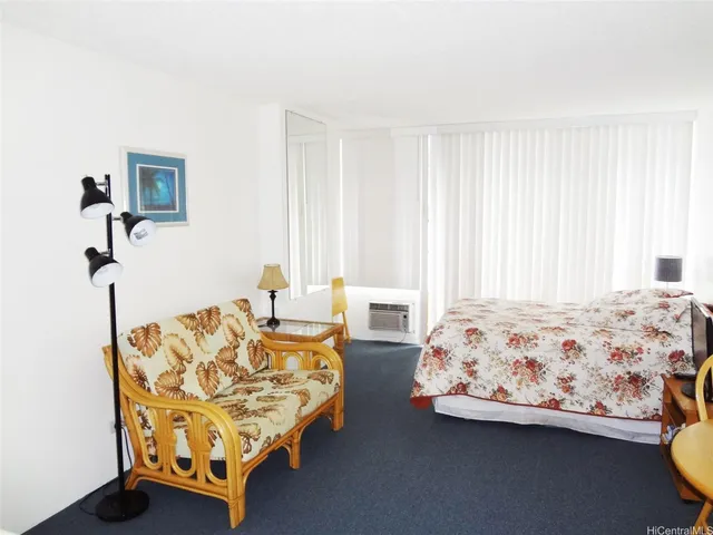 a bedroom with bed and window