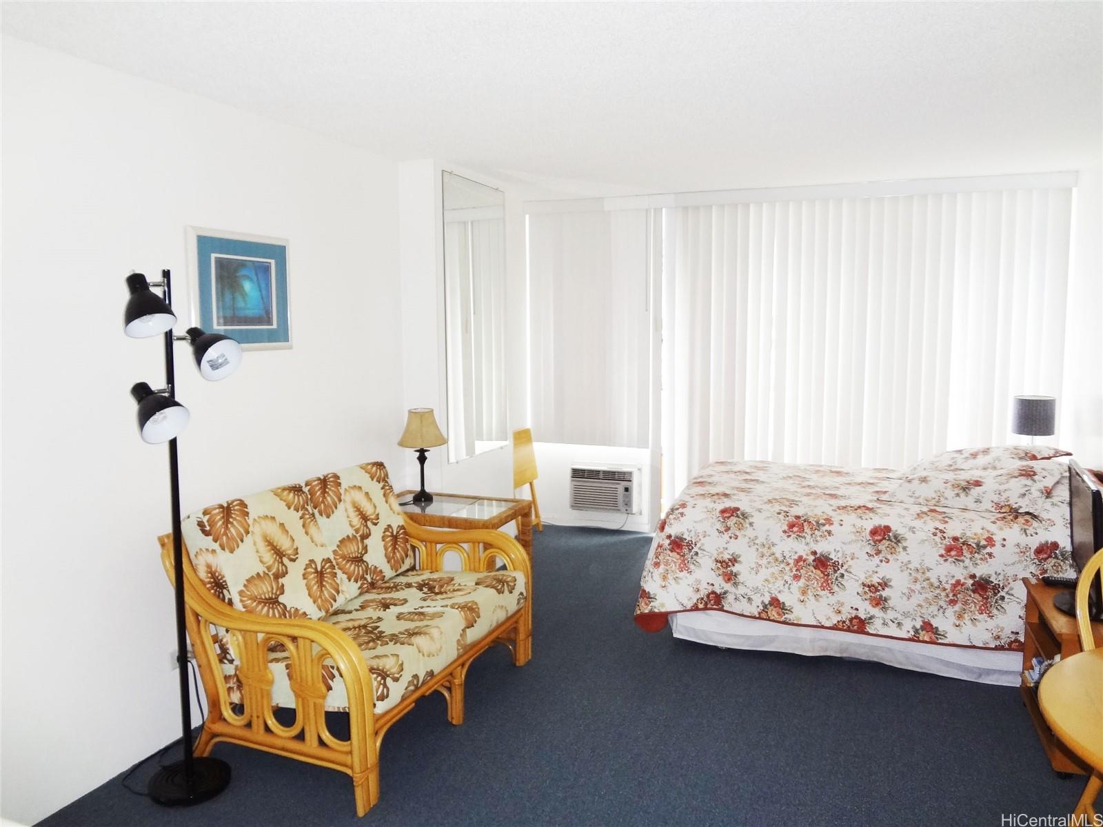 2572 Lemon Road, Unit 502 Honolulu, HI 96815 - Photo 4 of 7 a bedroom with bed and window