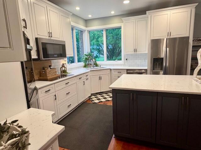 9261 Ruth Court St. John, IN 46373 - Photo 11 of 48 a kitchen with a sink stove and refrigerator