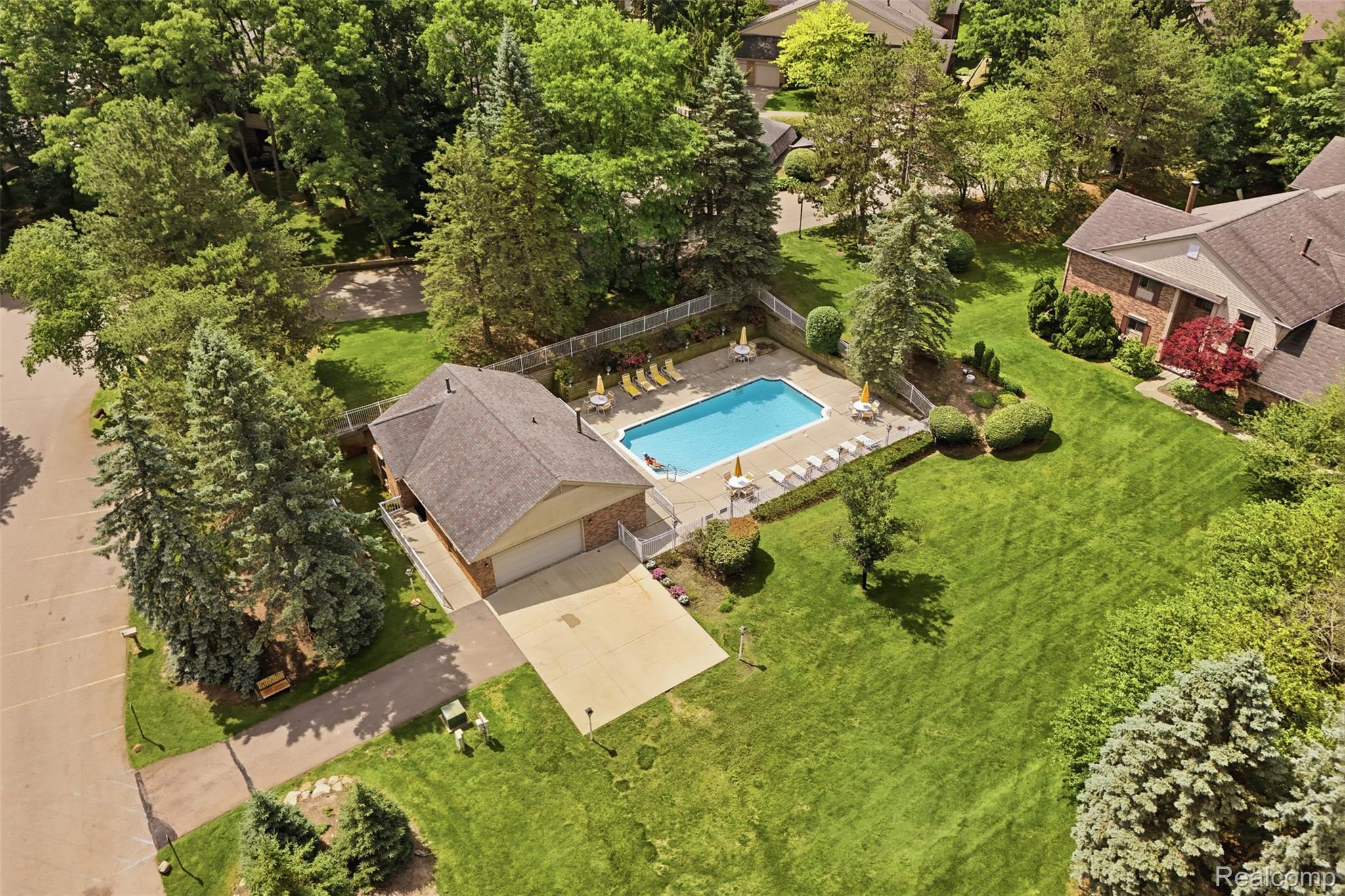 29726 Pine Ridge Circle Farmington, MI 48331 - Photo 31 of 40 Outdoor swimming pool surrounded