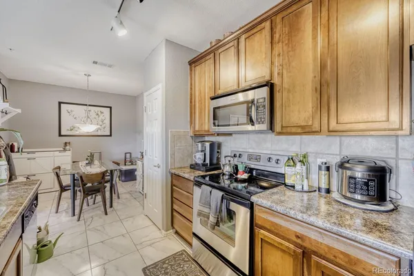 a kitchen with lots of counter top space and appliances