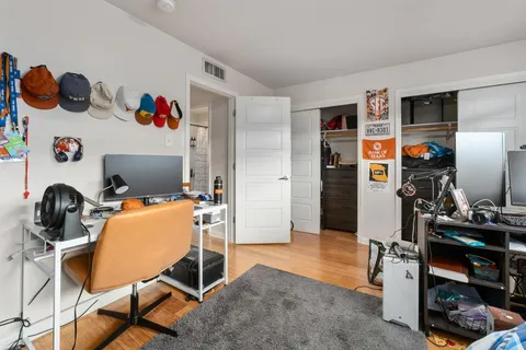 a workspace with furniture and closet