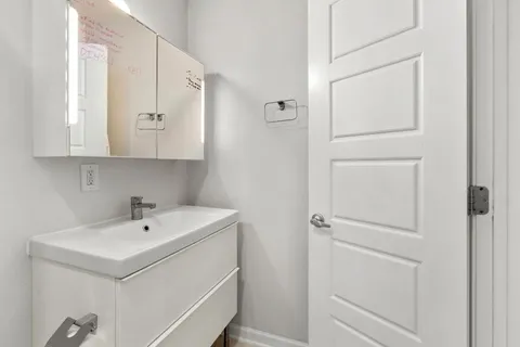 a utility room with cabinets washer and dryer