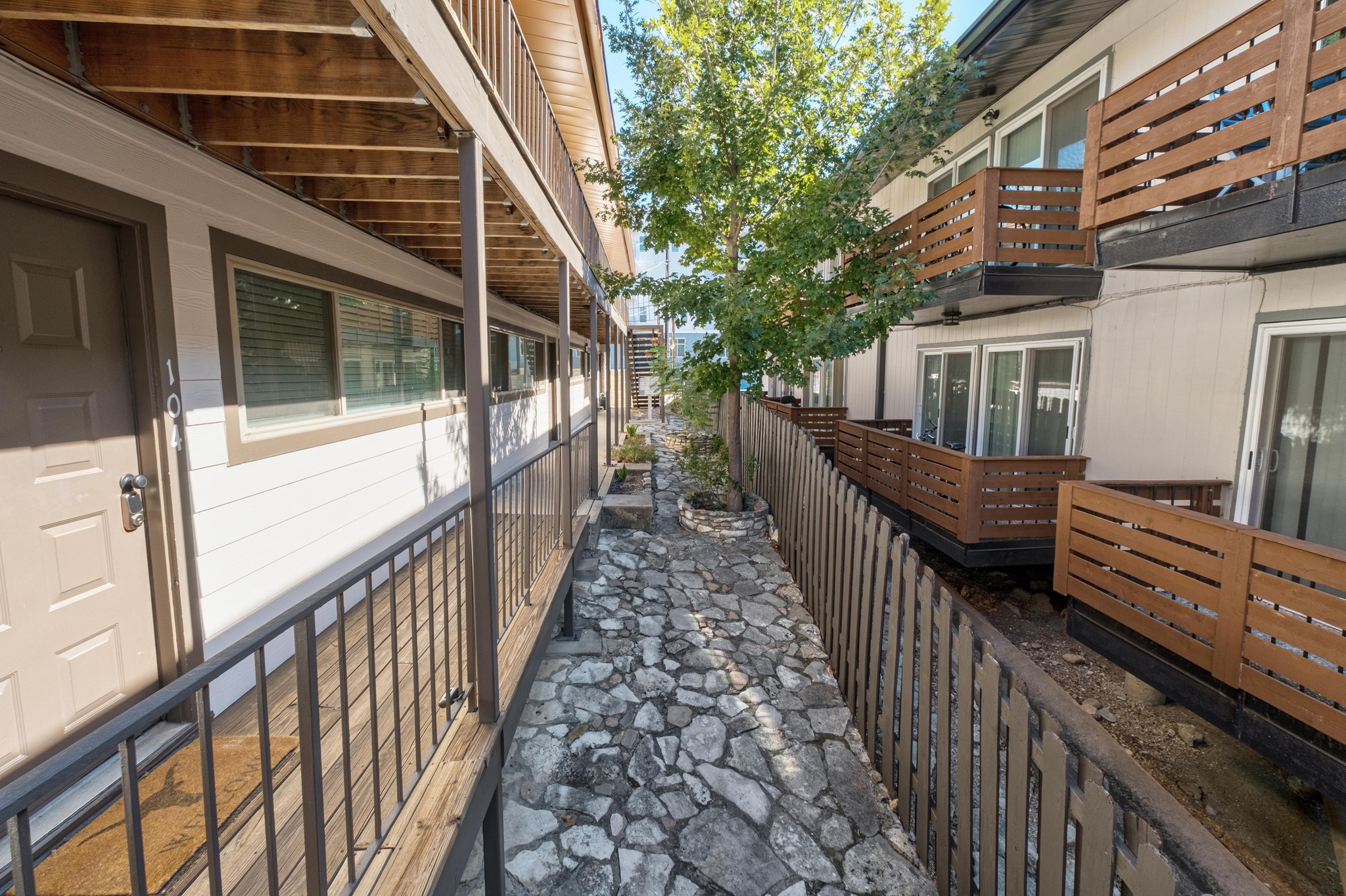 2404 Longview Street, Unit 105 Austin, TX 78705 - Photo 21 of 21 a view of a house with wooden deck