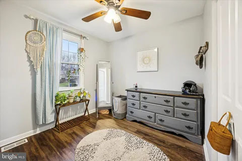 a bedroom with a bed and a dresser