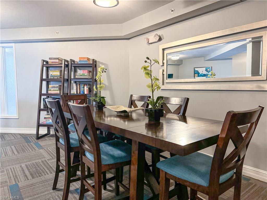 1100 Pine Ridge Road, Unit 105B Naples, FL 34108 - Photo 11 of 11 Dining area with dark colored carpet