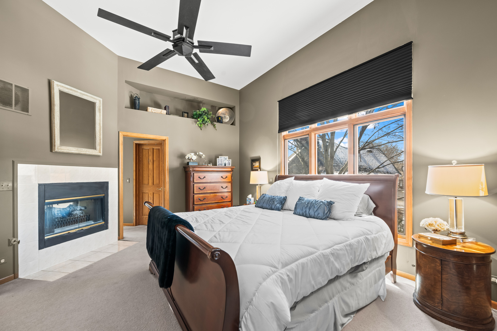 1380 Prestwick Lane Itasca, IL 60143 - Photo 17 of 45 a bedroom with a balcony a bed and a fireplace