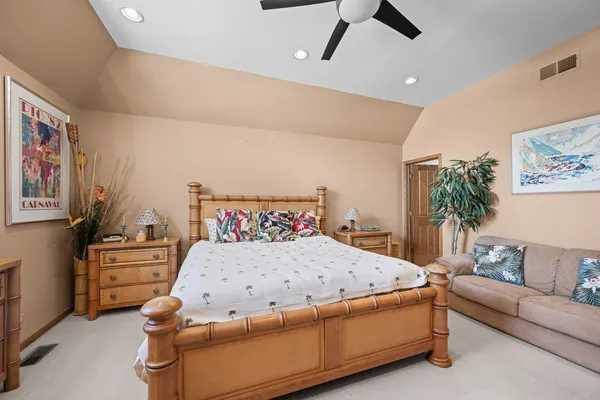 a bedroom with a bed and furniture