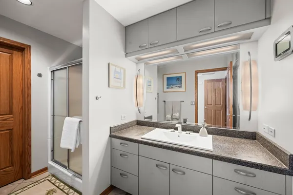 a bathroom with a double vanity sink and mirror