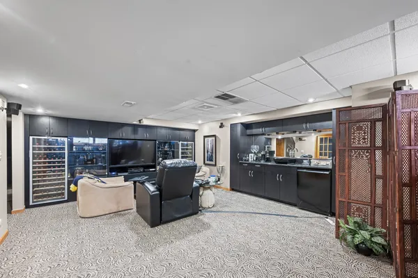 a kitchen with a refrigerator and a sink