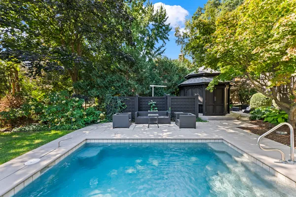 a view of a table and chairs in patio of the house
