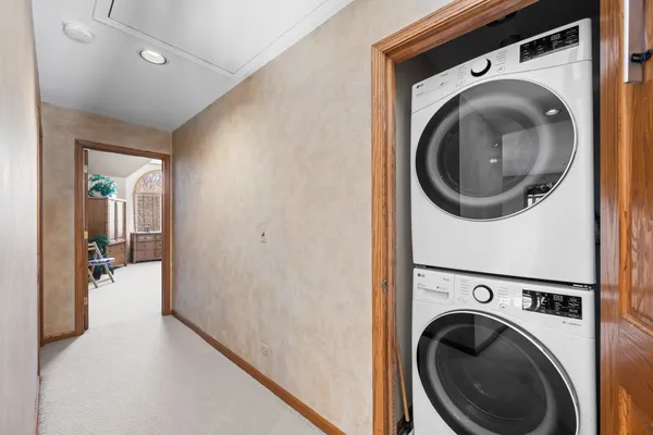 a view of a hallway with washer and dryer