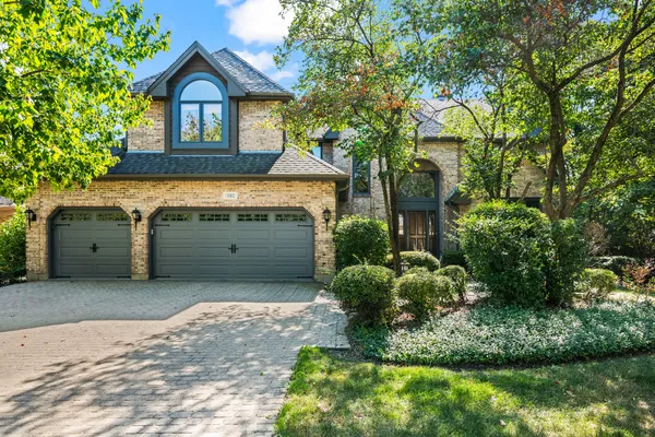 a view of front of house with a yard