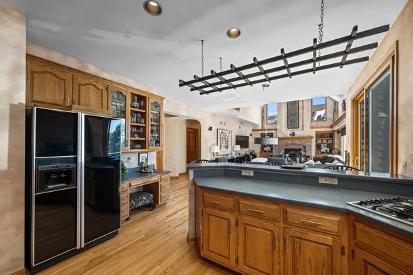 a kitchen with lots of counter top space and stainless steel appliances