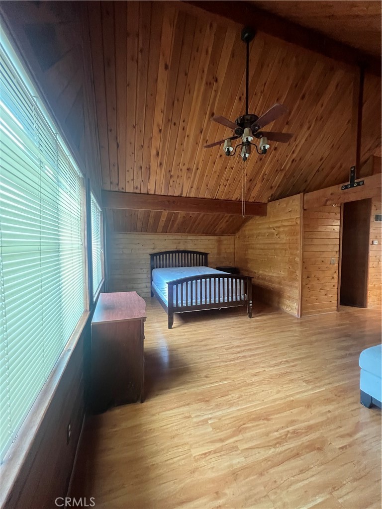 29716 Jackson Street Castaic, CA 91384 - Photo 12 of 38 a balcony with table & chairs and wooden floor