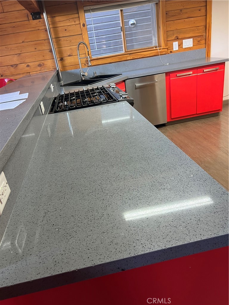 29716 Jackson Street Castaic, CA 91384 - Photo 31 of 38 a kitchen with a sink a stove and a microwave