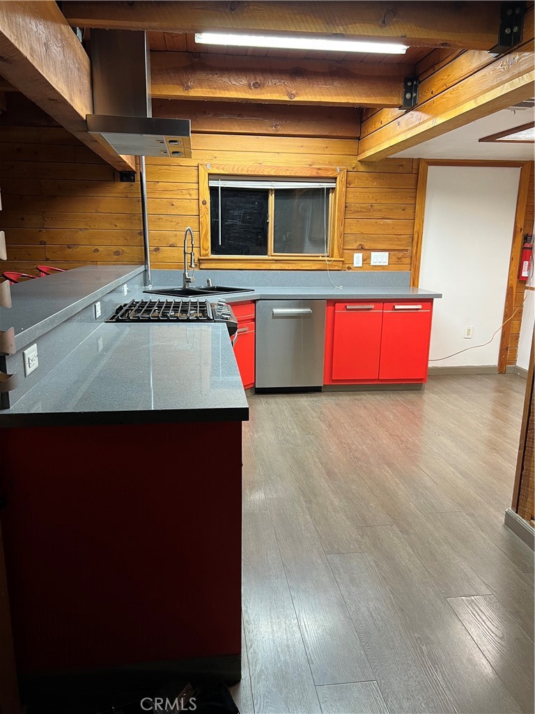 29716 Jackson Street Castaic, CA 91384 - Photo 37 of 38 a kitchen with kitchen island sink refrigerator and microwave