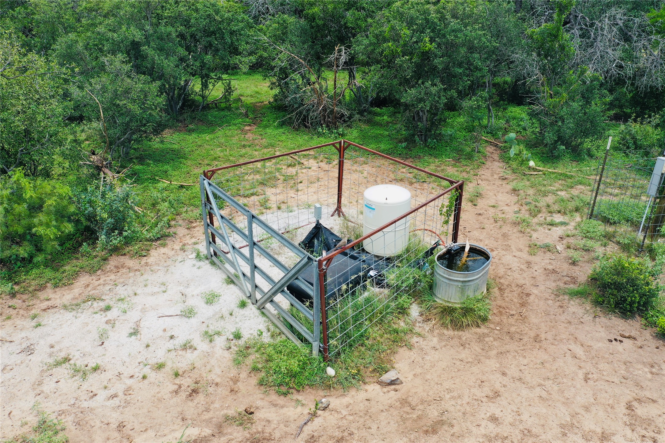 23601 Old Ferry Road, Unit 1 Spicewood, TX 78669 - Photo 25 of 33 a view of a backyard with sitting area