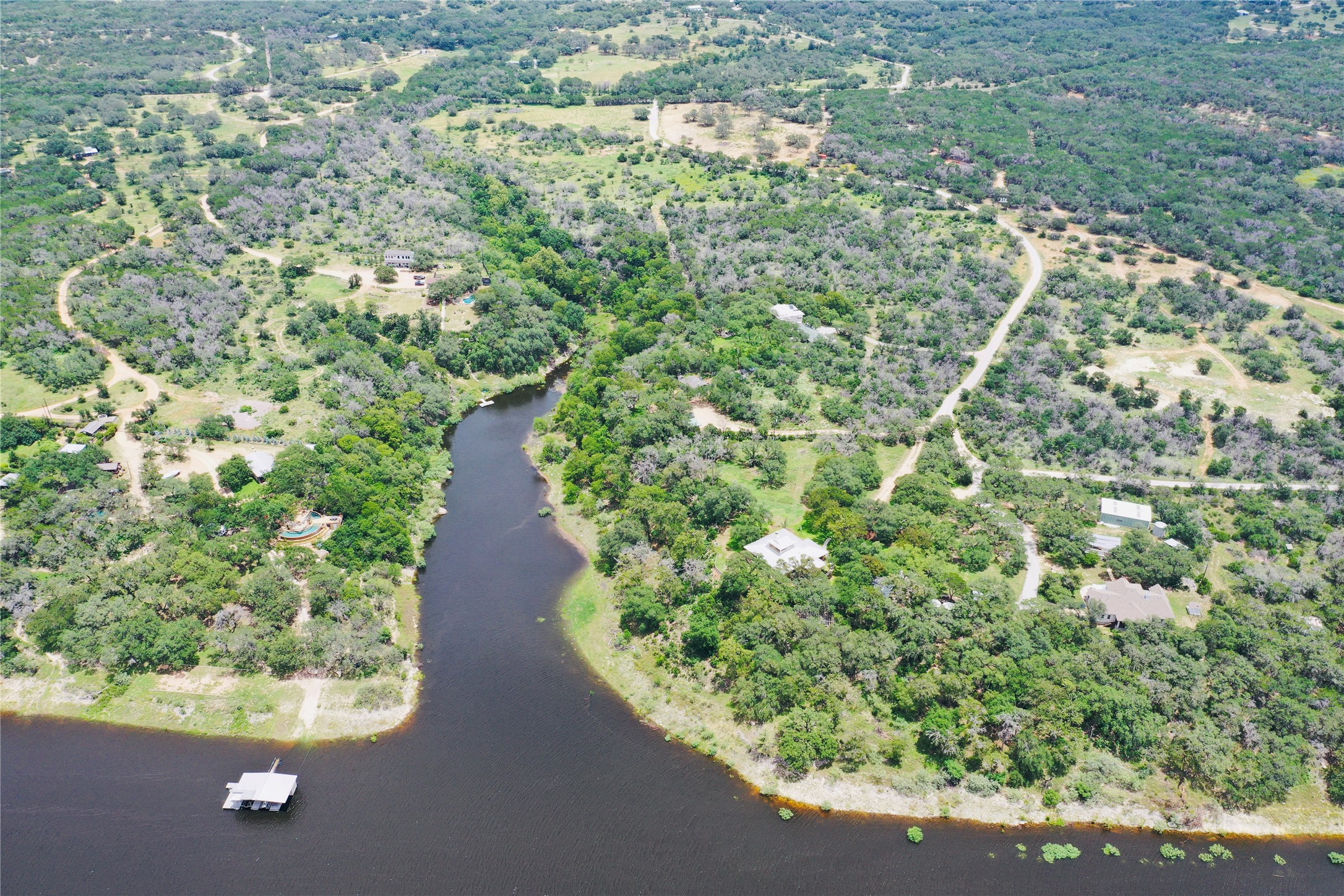 23601 Old Ferry Road, Unit 1 Spicewood, TX 78669 - Photo 5 of 33 a view of a green yard