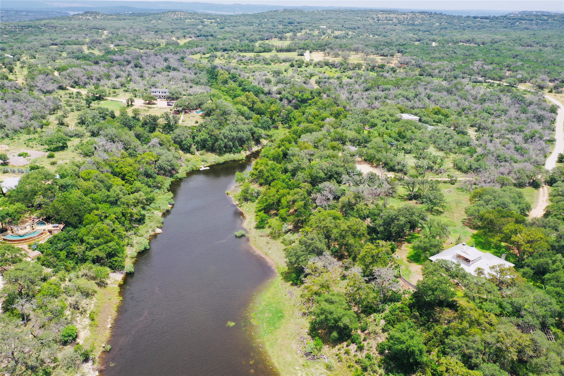 23601 Old Ferry Road, Unit 1 Spicewood, TX 78669 - Photo 6 of 33 a view of a green field