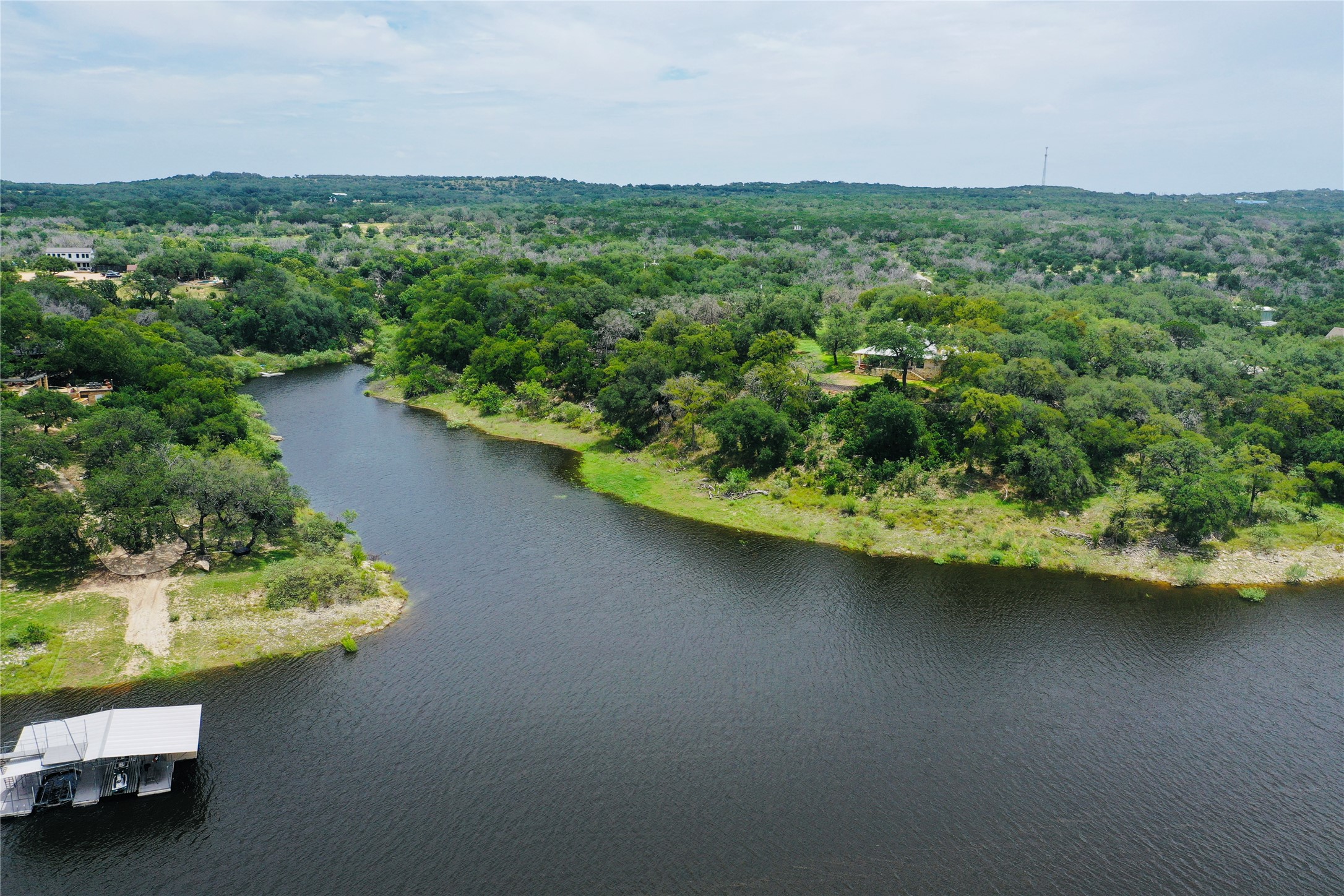 23601 Old Ferry Road, Unit 1 Spicewood, TX 78669 - Photo 8 of 33 an aerial view of a house with a yard and lake view
