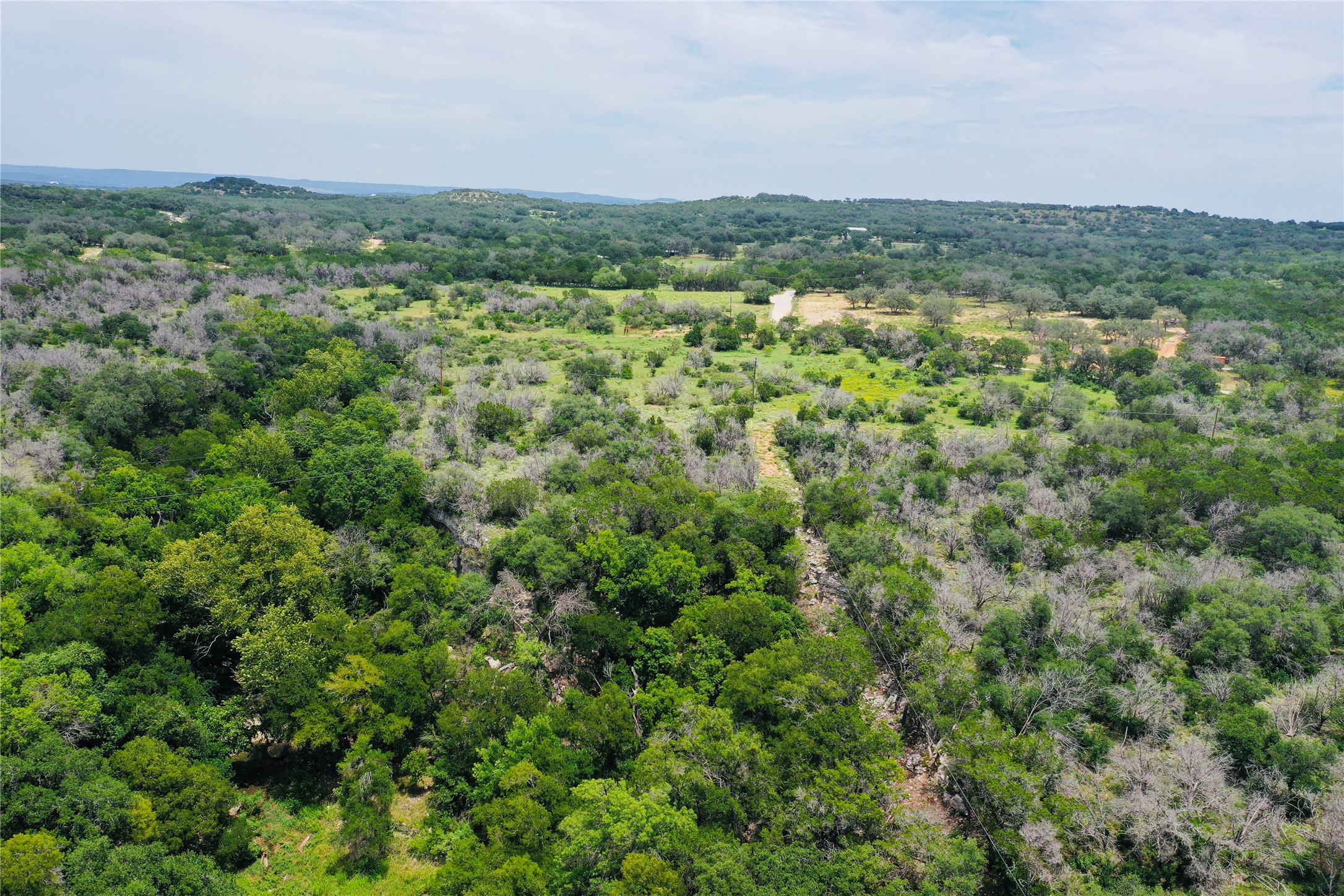 23601 Old Ferry Road, Unit 1 Spicewood, TX 78669 - Photo 10 of 33 a view of a green field