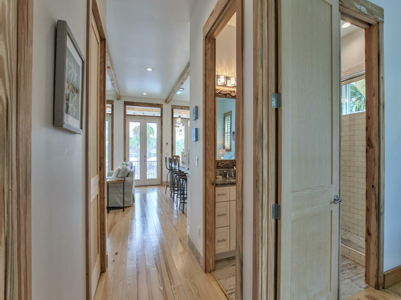 42 West Seacrest Beach Blvd Inlet Beach Inlet Beach, FL 32461 - Photo 18 of 52 a hallway with wooden floor windows and livingroom