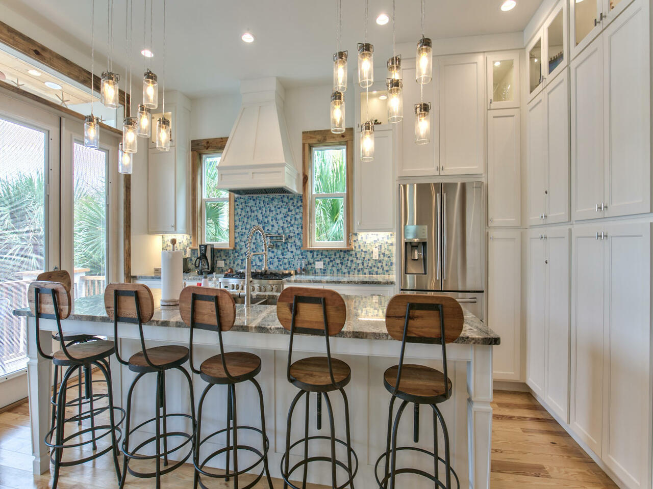 42 West Seacrest Beach Blvd Inlet Beach Inlet Beach, FL 32461 - Photo 26 of 52 a view of a dining room with furniture and a chandelier