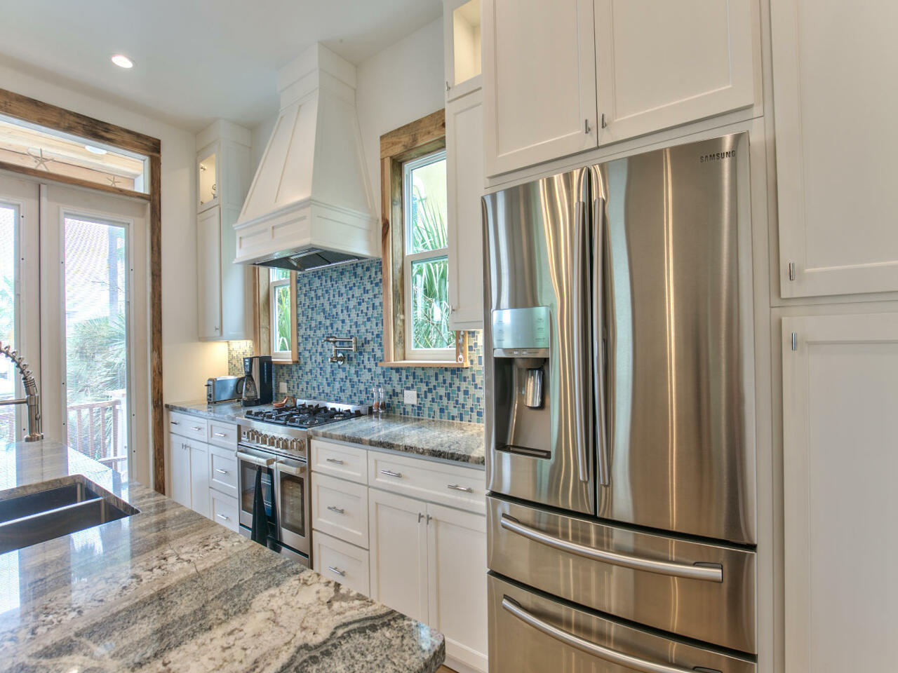 42 West Seacrest Beach Blvd Inlet Beach Inlet Beach, FL 32461 - Photo 30 of 52 a kitchen with stainless steel appliances granite countertop a refrigerator and a sink