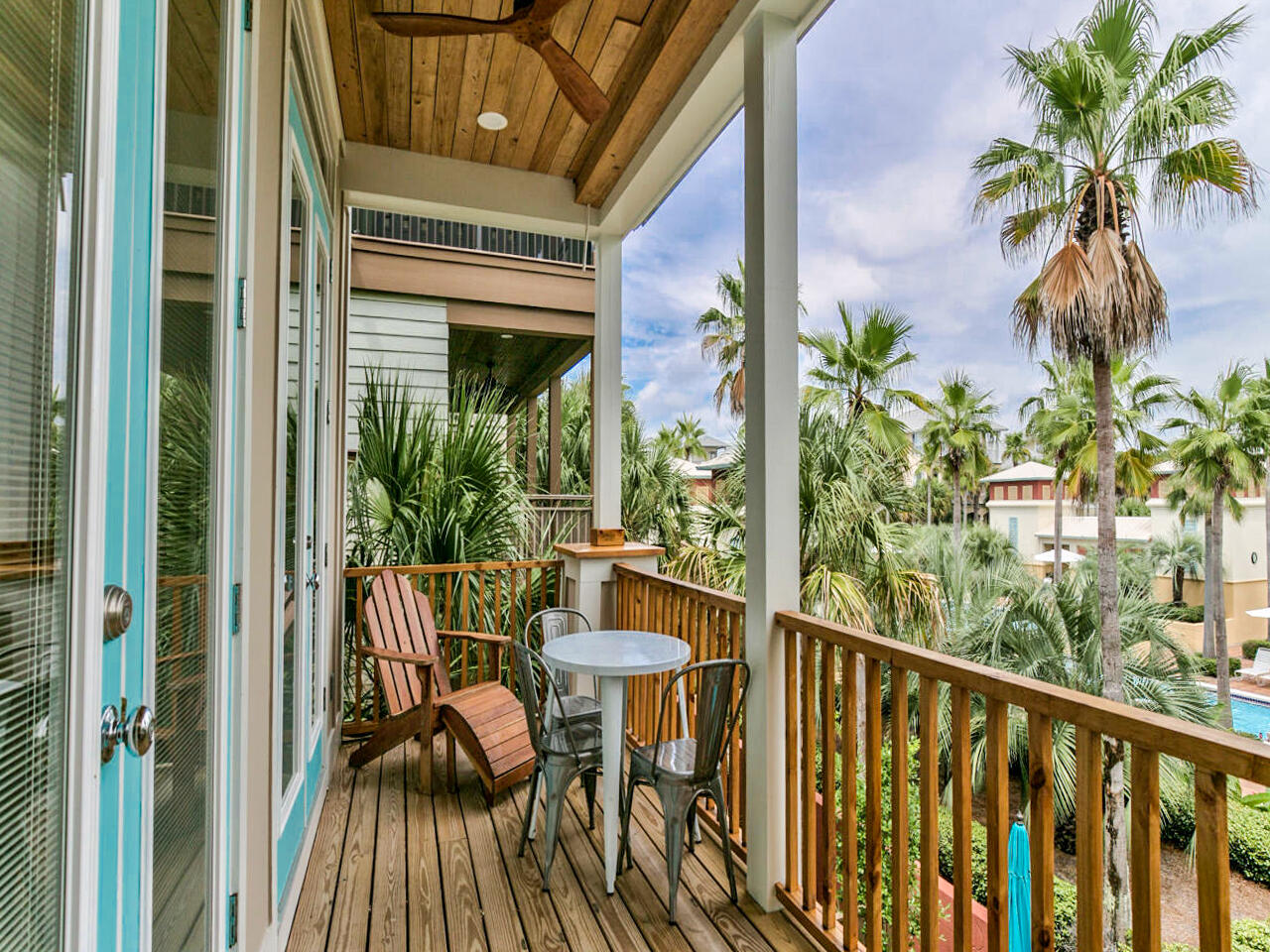 42 West Seacrest Beach Blvd Inlet Beach Inlet Beach, FL 32461 - Photo 33 of 52 a view of a balcony with table and chairs and potted plants