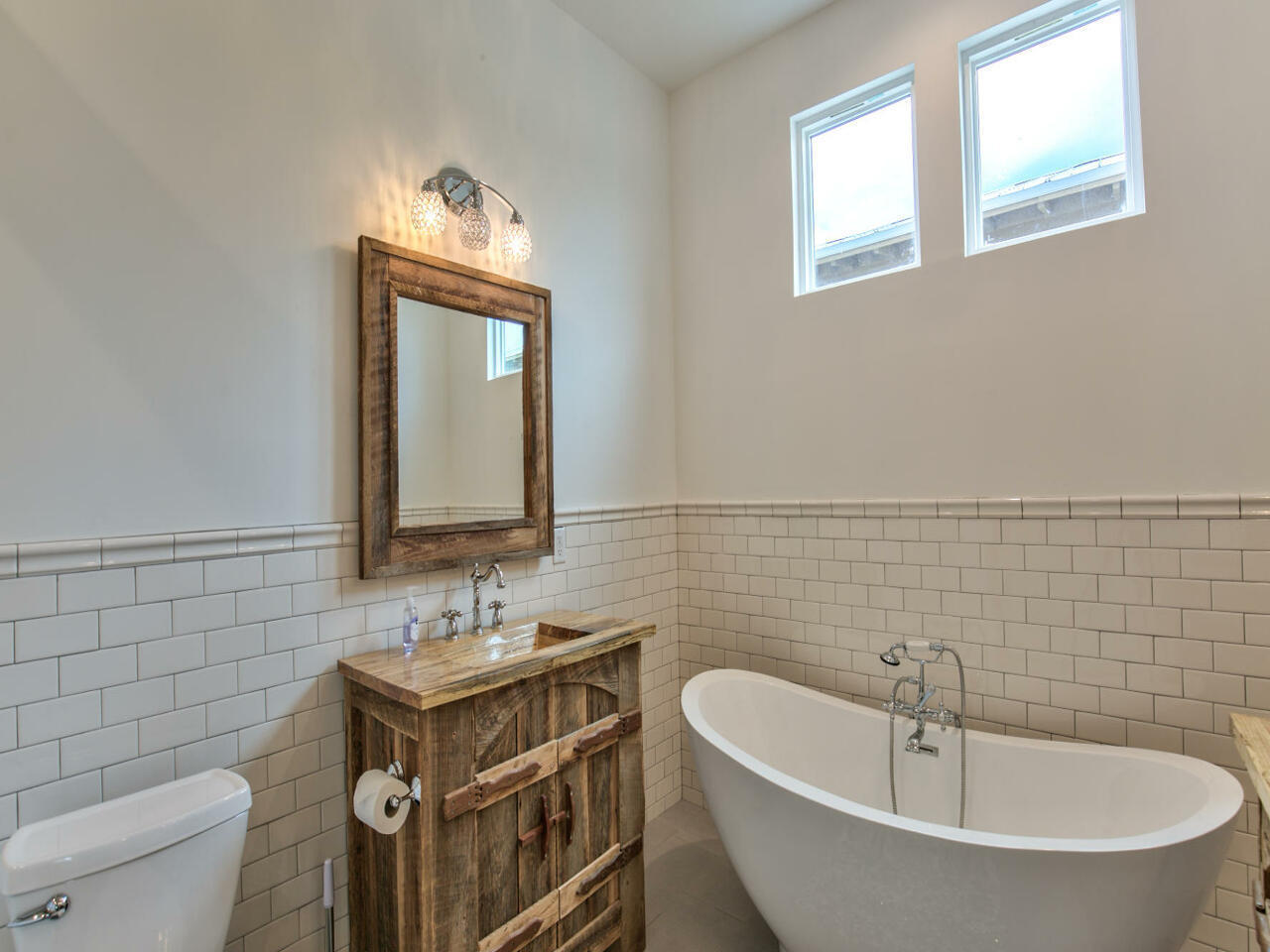 42 West Seacrest Beach Blvd Inlet Beach Inlet Beach, FL 32461 - Photo 42 of 52 a bathroom with a bathtub sink mirror and toilet