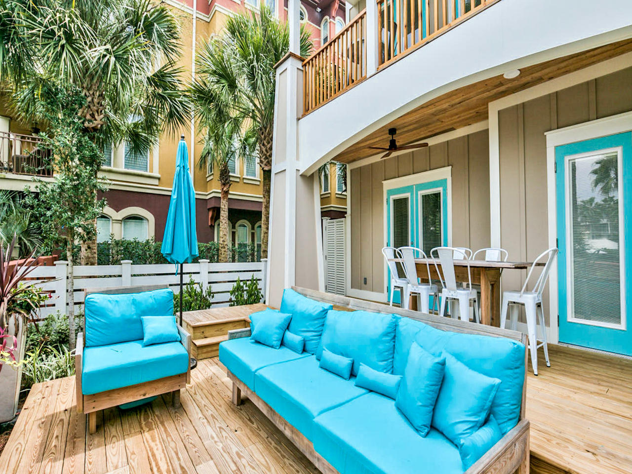 42 West Seacrest Beach Blvd Inlet Beach Inlet Beach, FL 32461 - Photo 50 of 52 a view of a patio with couches chairs and wooden floor