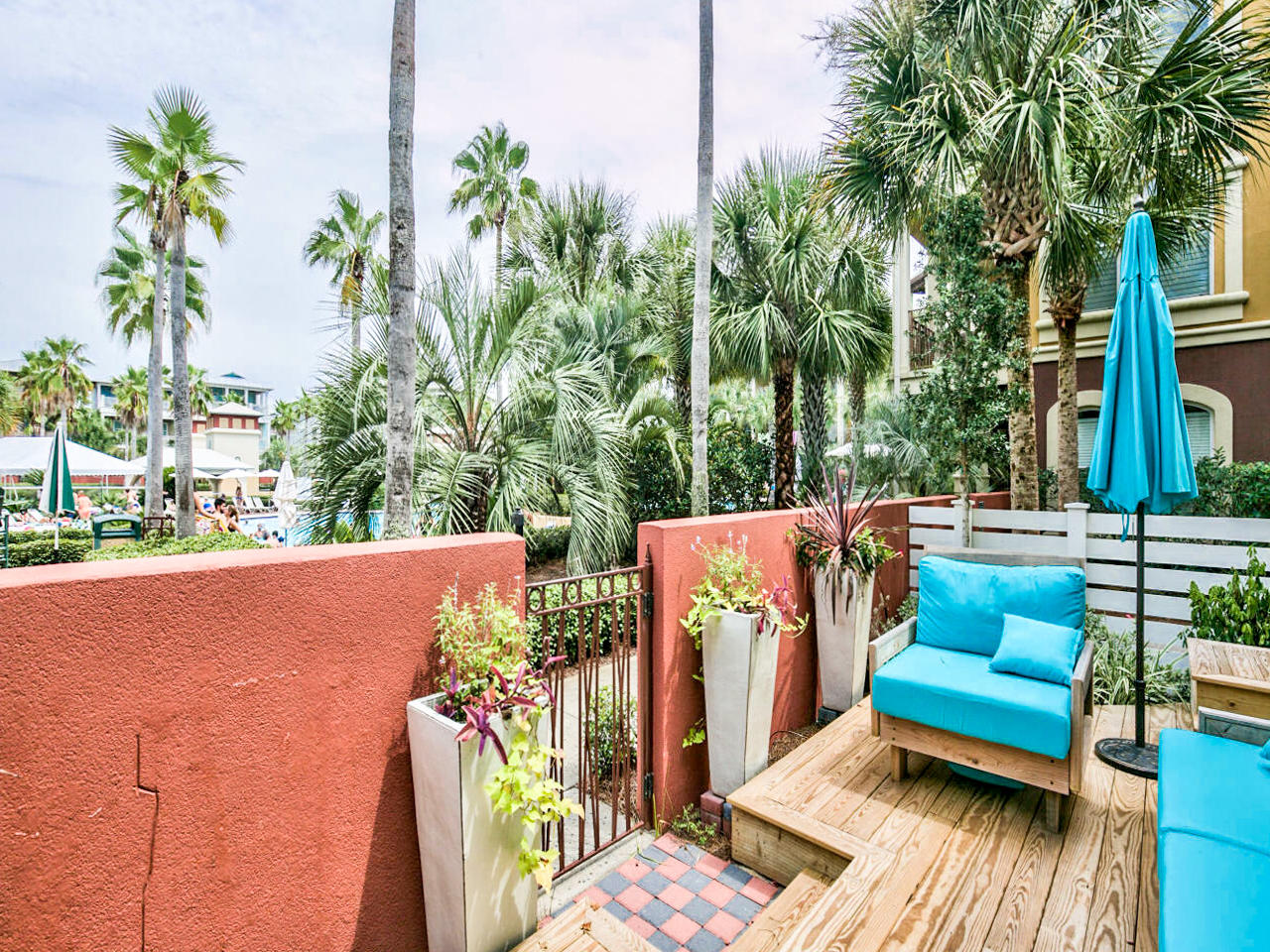42 West Seacrest Beach Blvd Inlet Beach Inlet Beach, FL 32461 - Photo 51 of 52 a view of a patio with couches table and chairs and potted plants