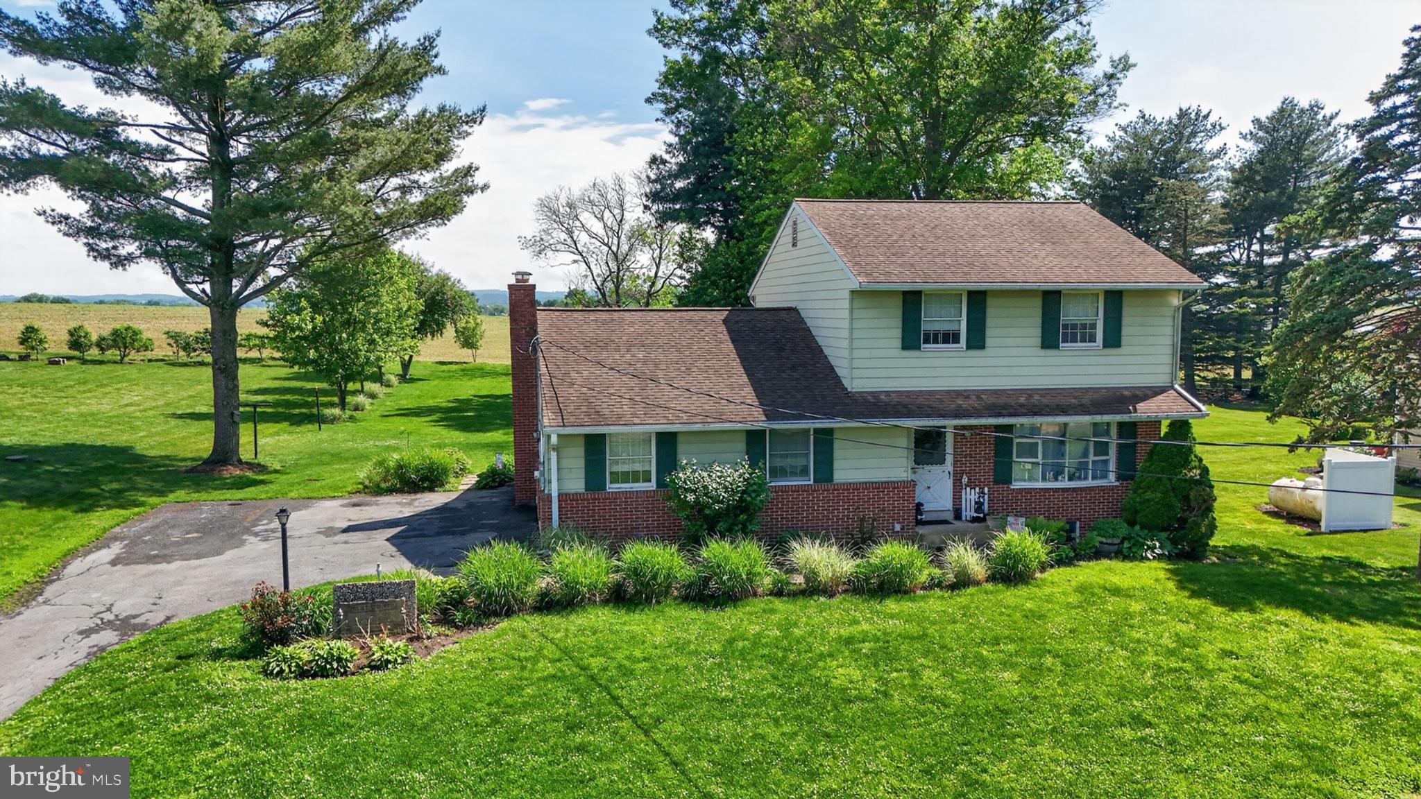 1106 Village Road Lancaster, PA 17602 - Photo 9 of 42 Charming home amidst lush greenery.