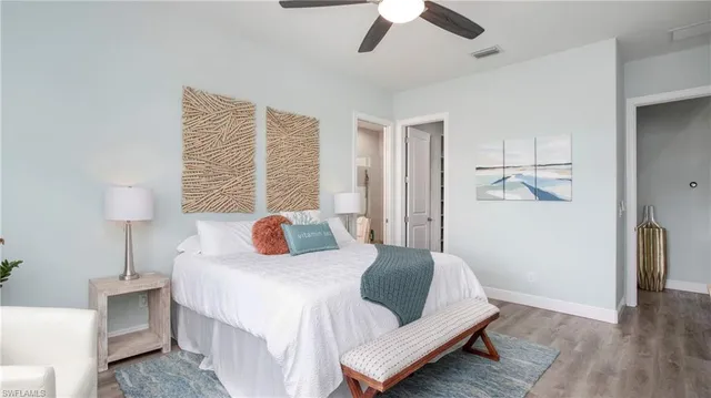 a bedroom with a bed and a night stand