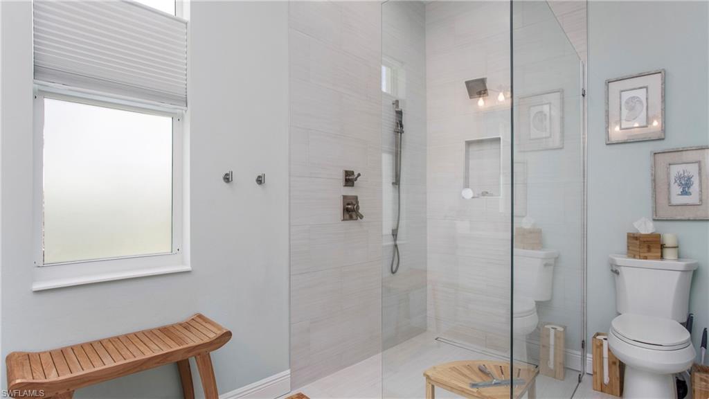 162 Windward Cay Naples, FL 34114 - Photo 26 of 35 a bathroom with a shower and toilet