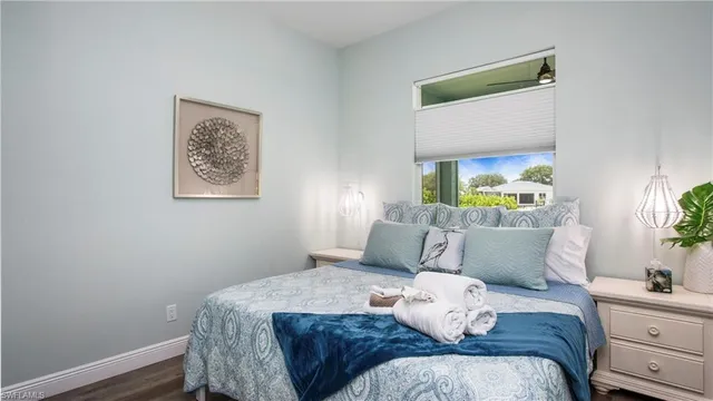 a bedroom with a bed and window