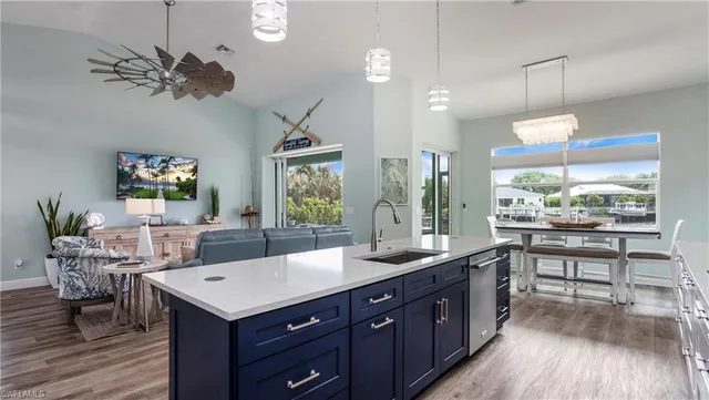 a kitchen with a table and chairs