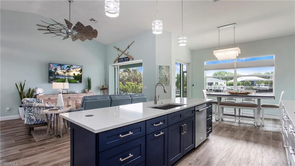 162 Windward Cay Naples, FL 34114 - Photo 5 of 35 a kitchen with a table and chairs