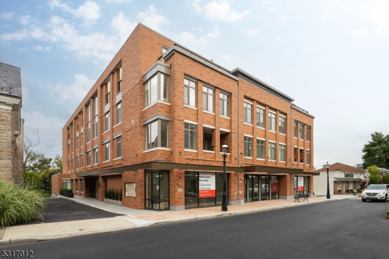 14 Lincoln Place, Unit 208 Madison, NJ 07940 - Photo 14 of 17 a front view of a building with street