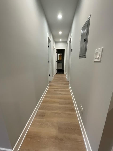 1552 West Juneway Terrace, Unit 2F Chicago, IL 60626 - Photo 6 of 9 a view of a hallway with wooden floor and staircase