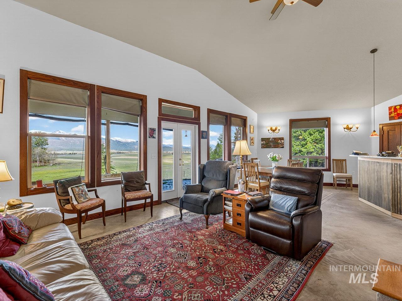 10885 Callender Road Cascade, ID 83611 - Photo 11 of 31 Living area featuring a vaulted ceiling and concrete flooring