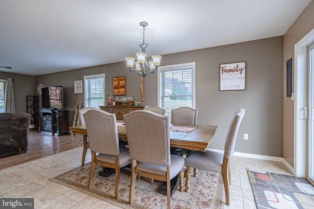 a view of washer and dryer with wooden floor