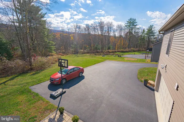 a view of a road with of car parked