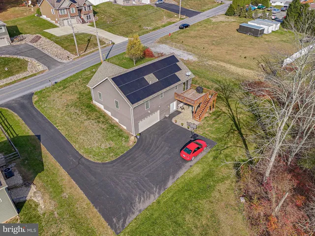 an aerial view of a house with swimming pool
