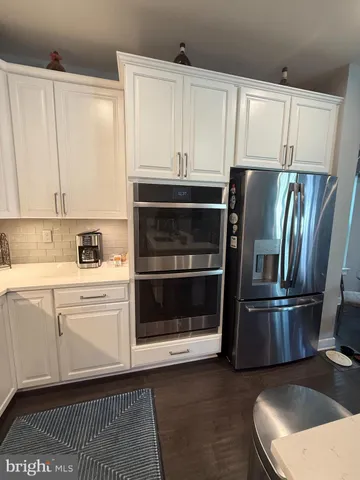 a bathroom with a toilet sink and a mirror
