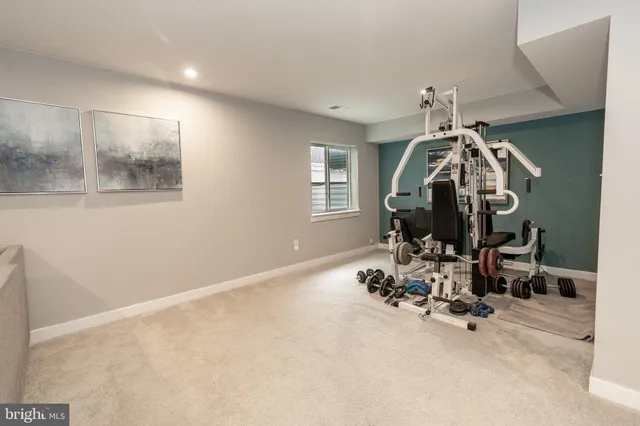 a view of a patio with couches and potted plants with sky view