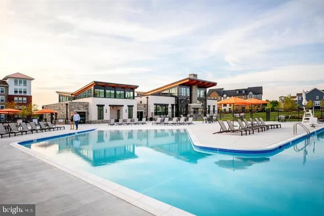 swimming pool view with a outdoor seating space